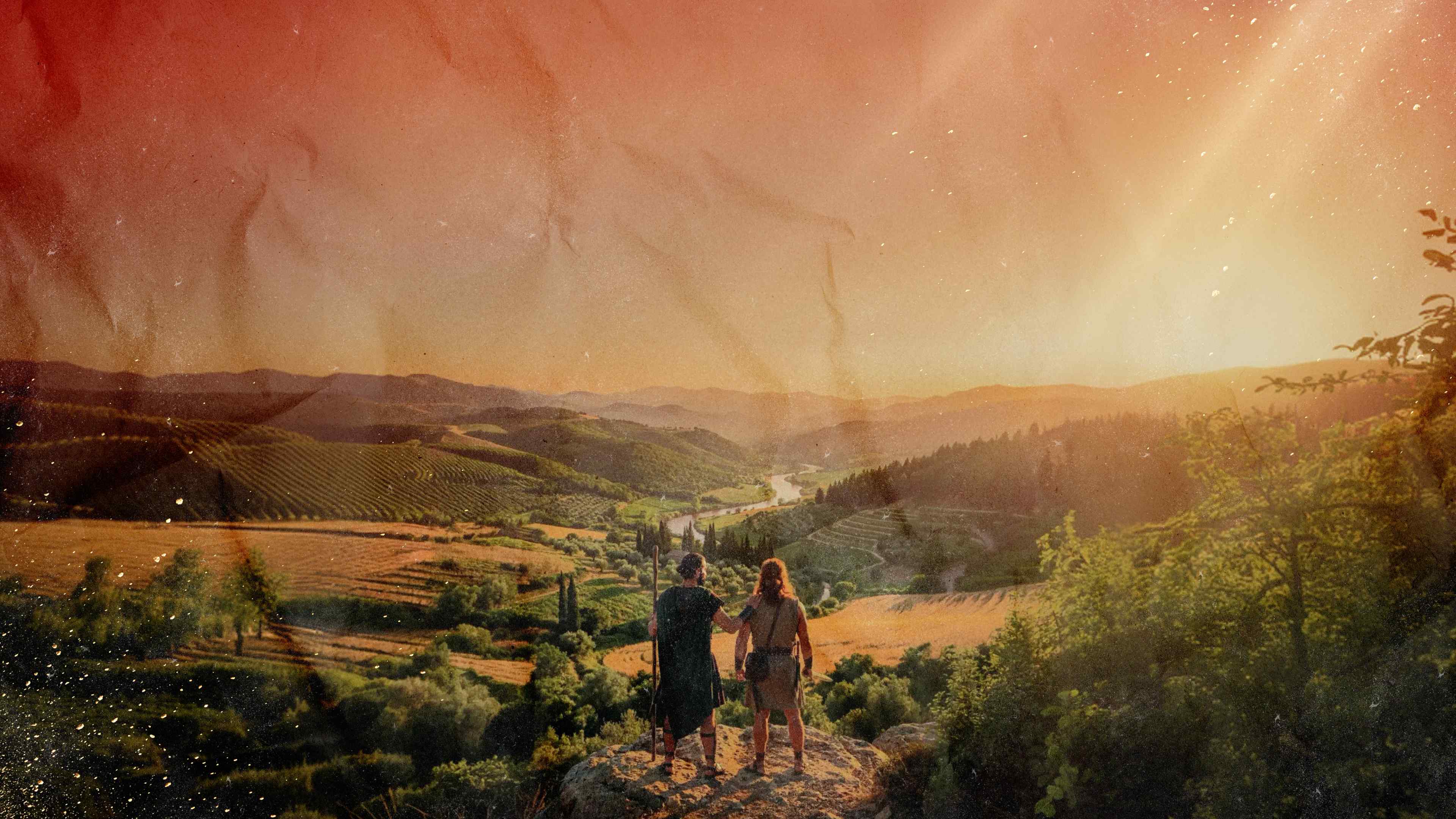Dos figuras bíblicas observando un valle al atardecer